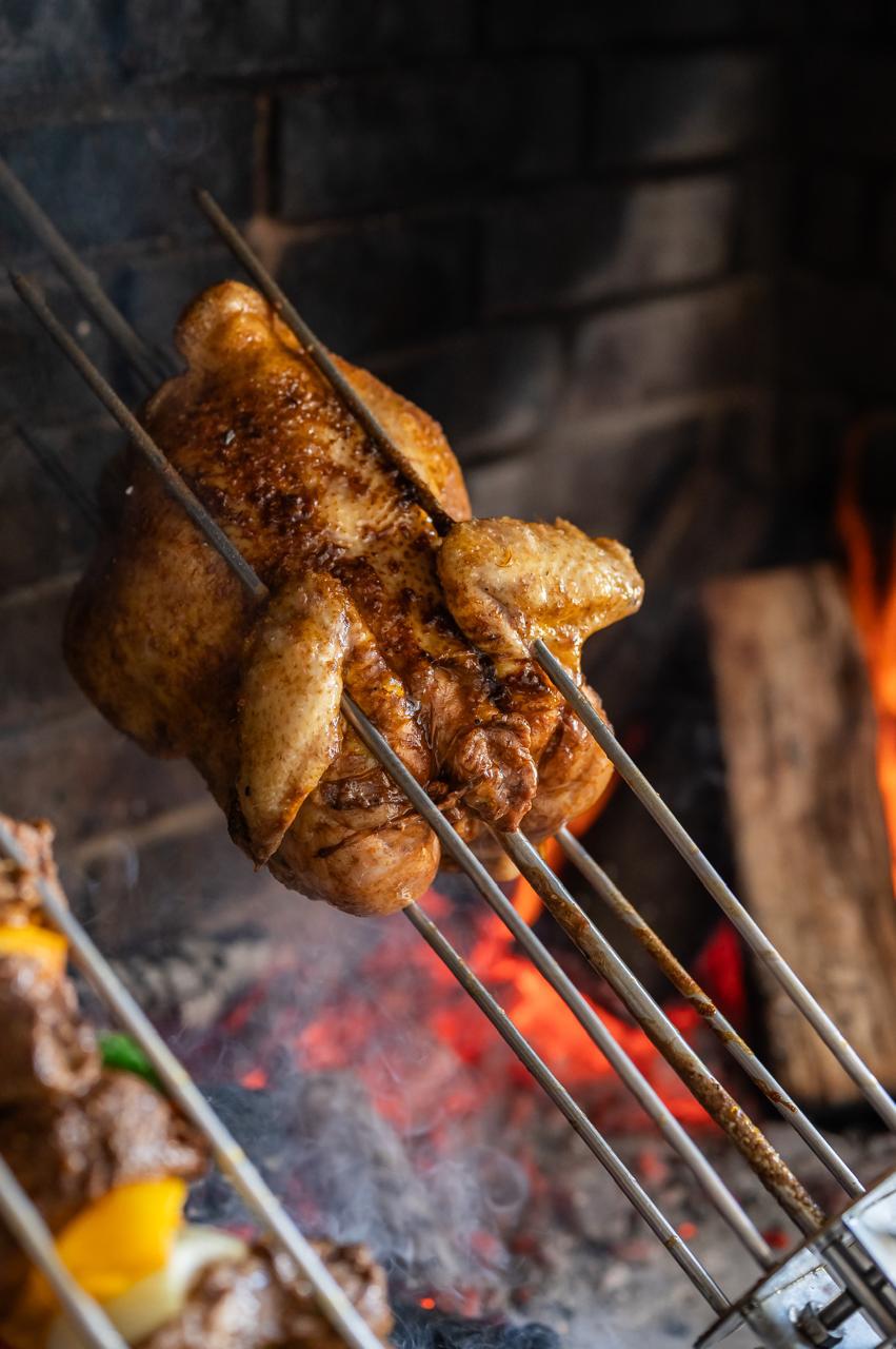 Chicken pieces cooking on the SpitAlles rotisserie skewers